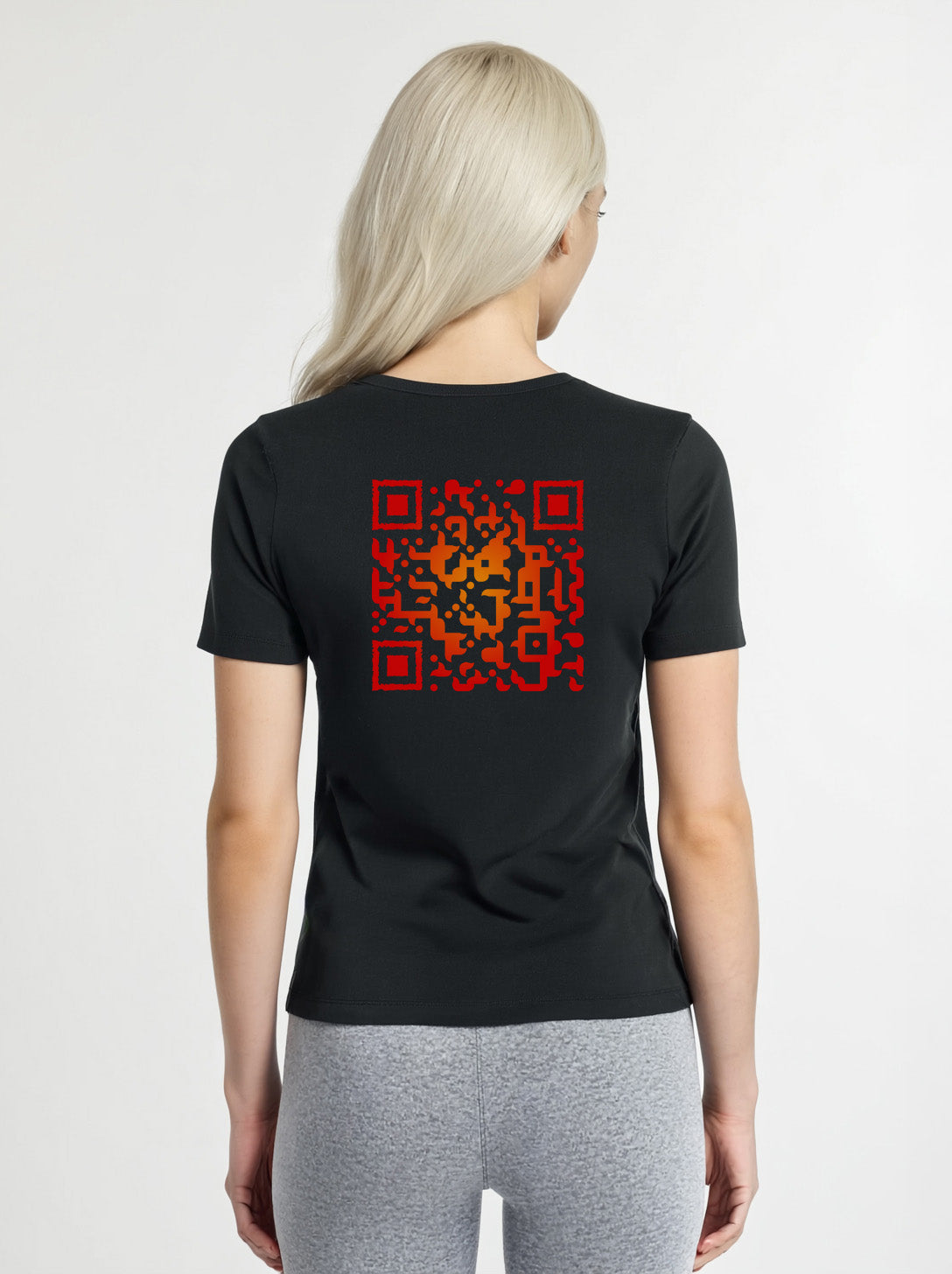 Woman wearing a black t-shirt from Cue R with a red QR code on the back.
