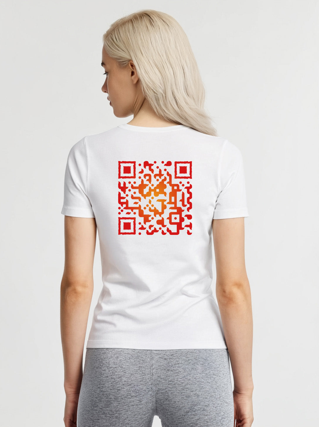 Woman wearing a white t-shirt from Cue R with a red QR code on the back.