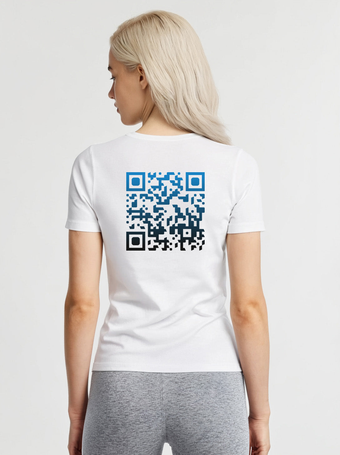 Women wearing a white t-shirt from Cue R with a blue-black QR code on the back.