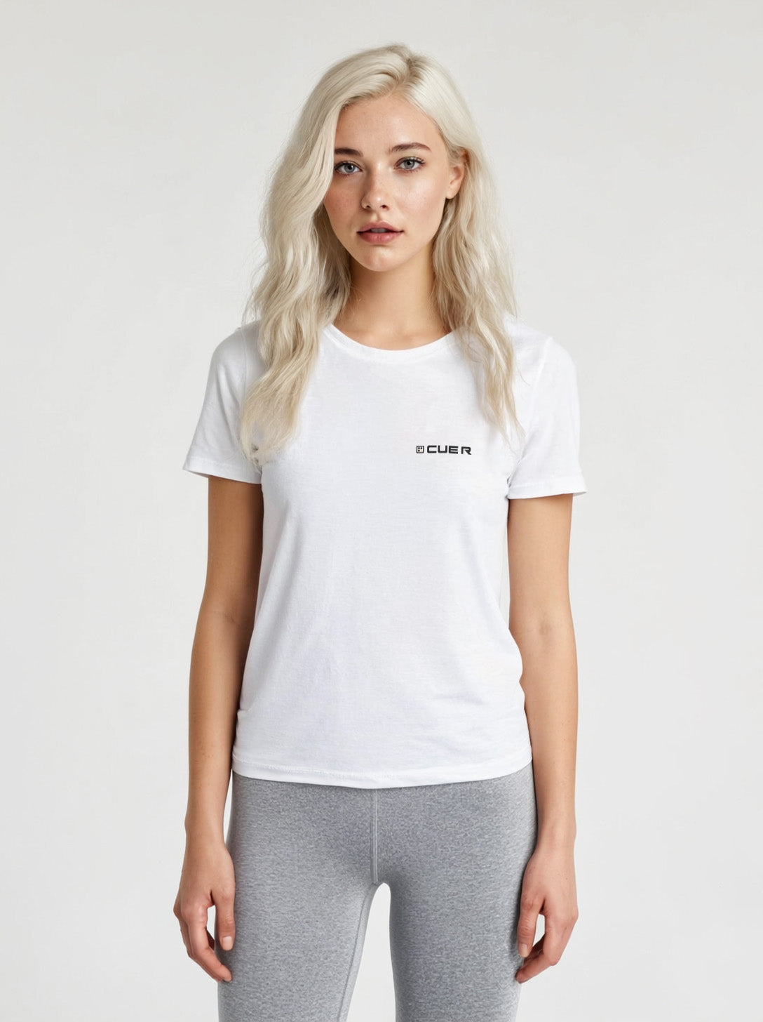 Woman wearing a white t-shirt with the Cue R logo on the front.