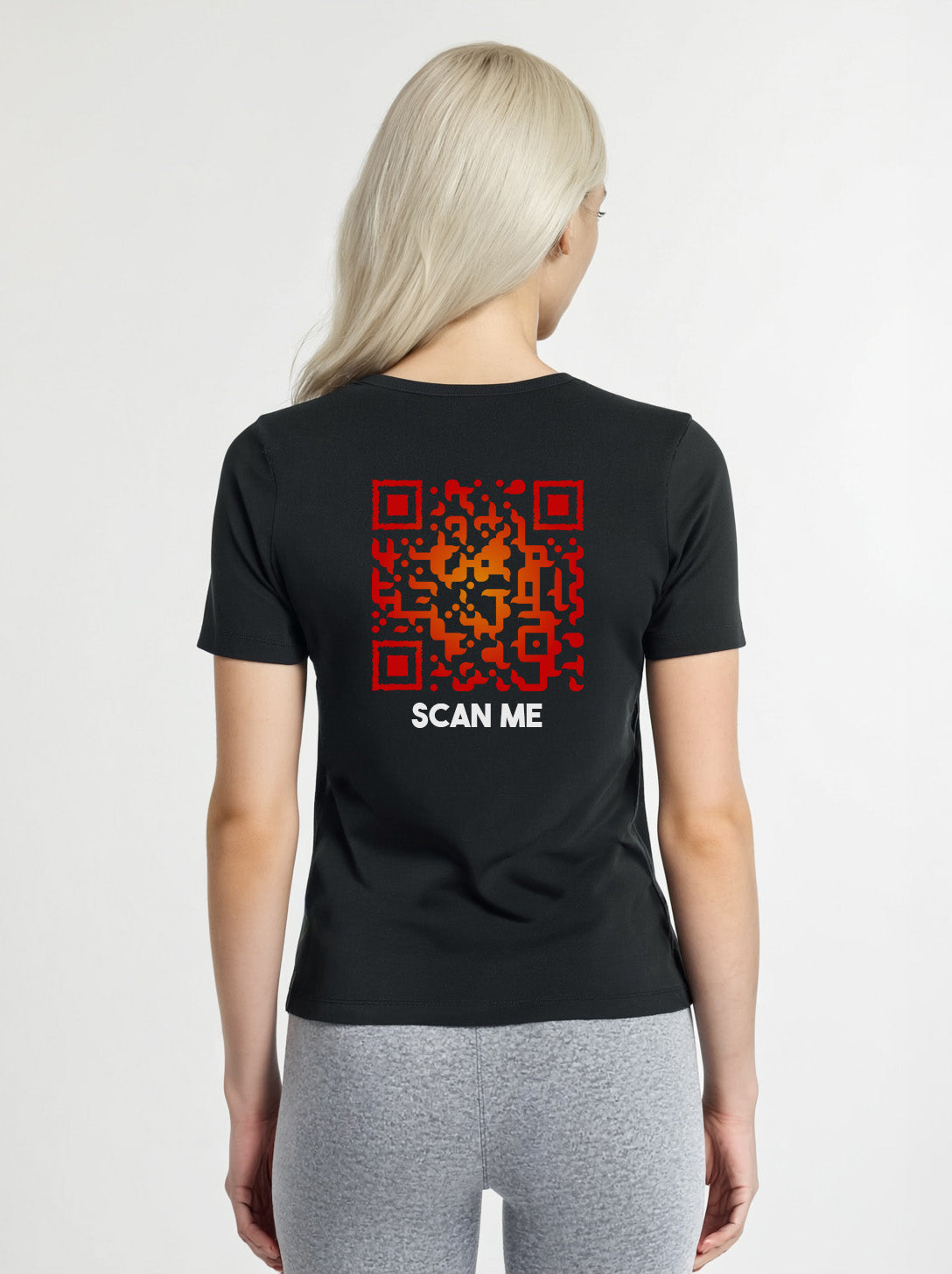 Women wearing a black t-shirt from Cue R with a red QR code and 'SCAN ME' text on the back.