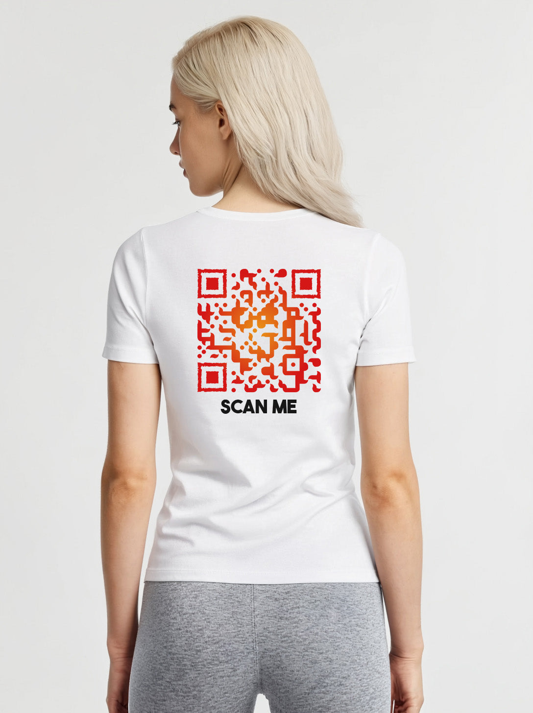 Women wearing a white t-shirt from Cue R with a red QR code and 'SCAN ME' text on the back.