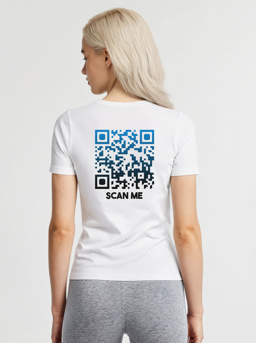 Women wearing a white t-shirt from Cue R with a blue-black QR code and 'SCAN ME' text on the back.